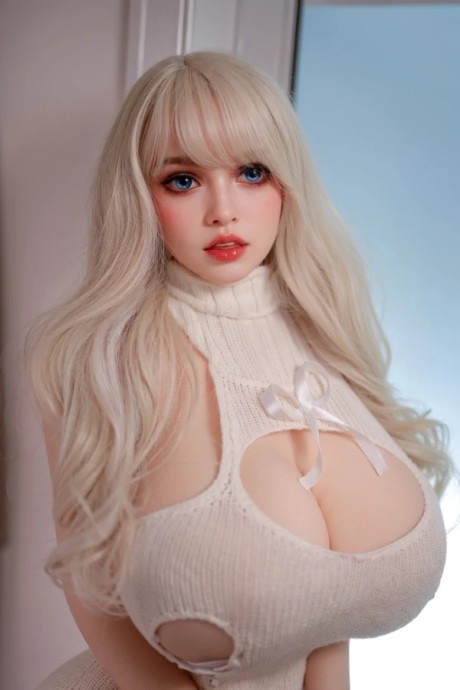 Hot blonde with striking eyes models in the nude and with her clothes on