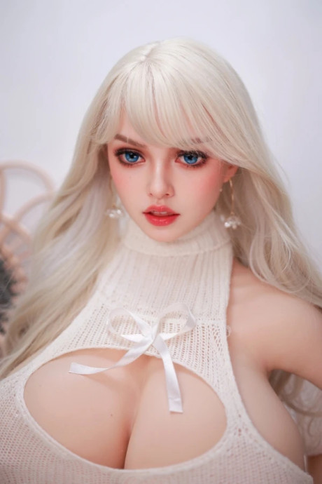 Hot blonde with striking eyes models in the nude and with her clothes on