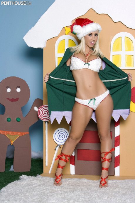 Attractive yellow-haired Jessica Lynn poses for a centerfold spread with an Xmas theme