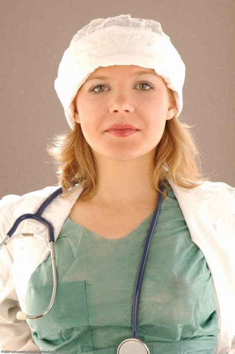 Pretty female doctor Lena inserts a speculum during a close-up show