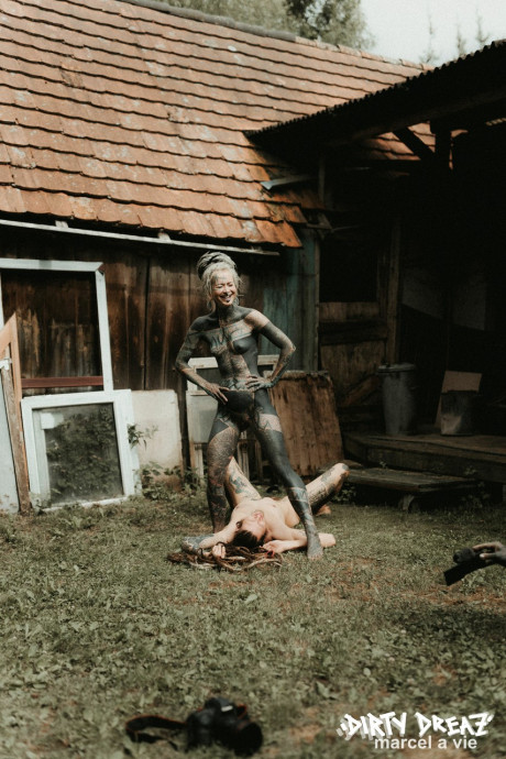 Heavily tattooed hoes piss on a undressed fiance bf lover outside the back steps of a house