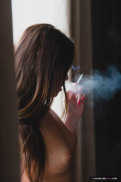 Spanish teen Nata Lee masturbates in her nylons after smoking a cigarette