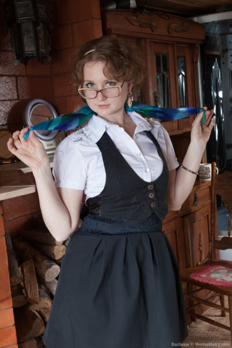Nerdy teen Bazhena exposes her huge butt and furry pussy in a solo
