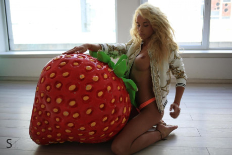 Marvelous young blondy Reuty bares her new silicone breasts and sweet body