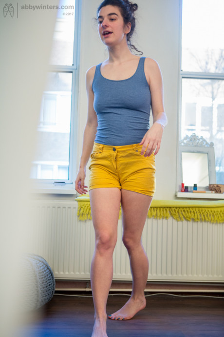 Undressed amateur Livia V is secretly filmed getting dressed by a hidden camera