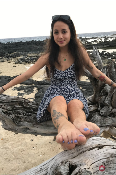 Teenie Mi Ha Doan flashes her tits and exposes her furry cunt on the beach