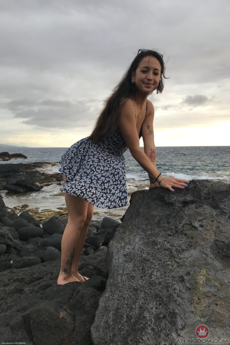 Teenie Mi Ha Doan flashes her tits and exposes her furry cunt on the beach