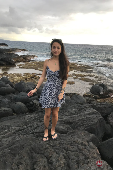 Teenie Mi Ha Doan flashes her tits and exposes her furry cunt on the beach