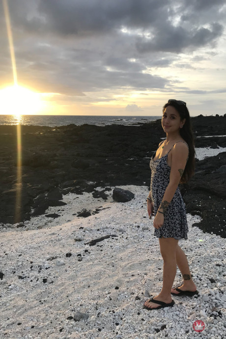 Teenie Mi Ha Doan flashes her tits and exposes her furry cunt on the beach