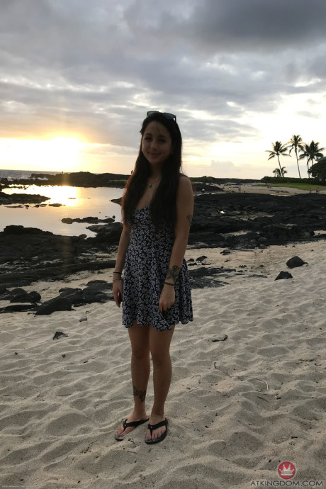 Teenie Mi Ha Doan flashes her tits and exposes her furry cunt on the beach