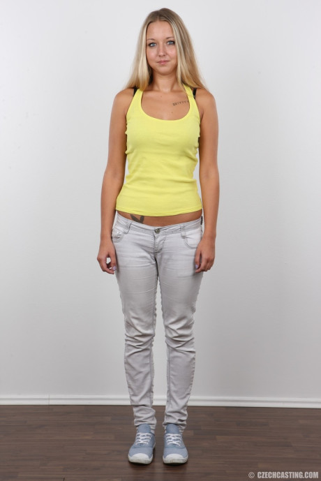 Attractive fresh teenie Tereza shows her bareback melons and smiley face in her first porn shoot