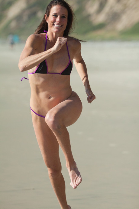 Pretty all-natural old Sofie Marie runs on the beach in a very skimpy bikini