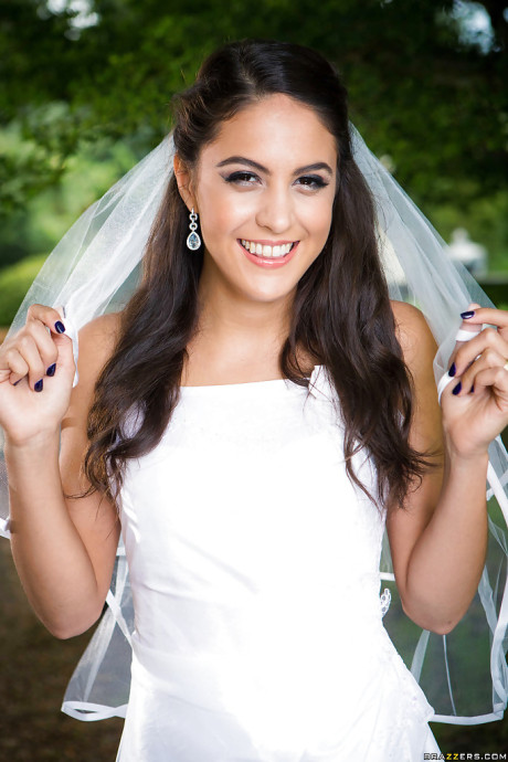 Latina babe Carolina Abril caught in candid outdoors wedding dress photos