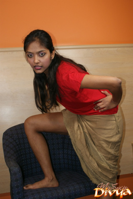 Indian solo model flashes her upskirt undergarment while eating an orange