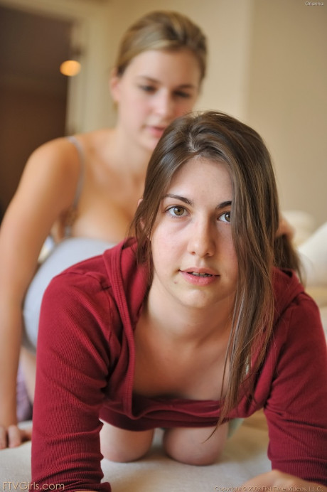 Brunette babe Orianna shows her swollen cunt and her friend her monstrous boobies