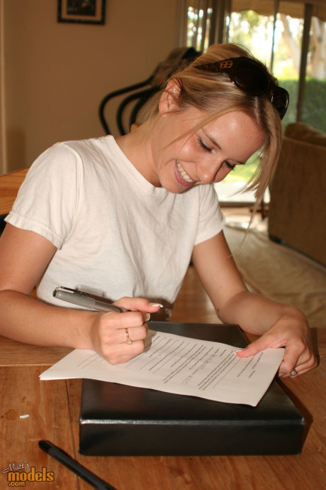 Fresh teenie yellow-haired stands undressed before signing undressed model release forms