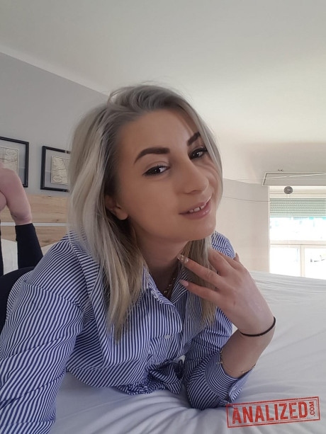 Amateur blondy Ari Fox reveals her small boobies and poses in front of a camera