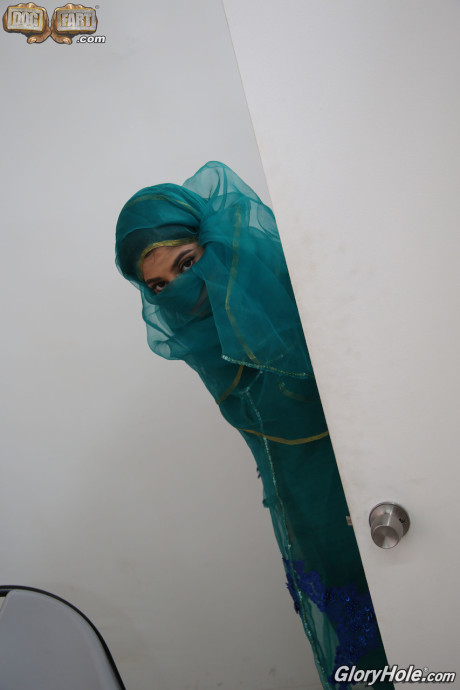Clothed Indian Nadia Ali gets nude after finding a BBC poking thru gloryhole