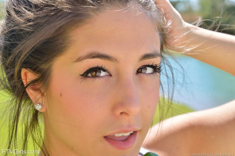 Wonderful teenie Natalie likes pleasing herself in public