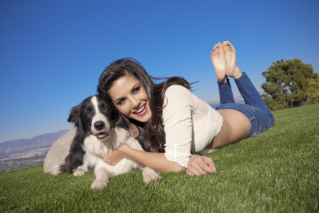 Sexy and cute brunette doll Sunny Leone poses outdoors in tight jeans