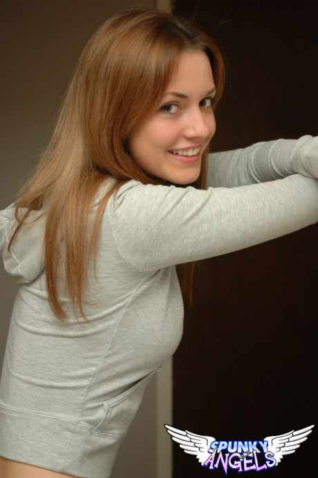 Amateur model with a gorgeous attractive face poses non nude in denim jeans