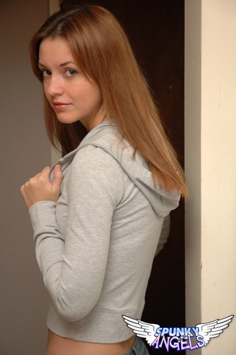 Amateur model with a gorgeous attractive face poses non nude in denim jeans