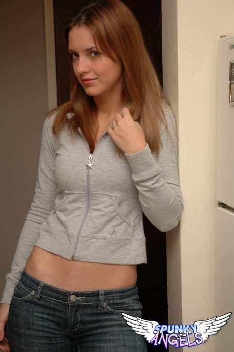 Amateur model with a gorgeous attractive face poses non nude in denim jeans