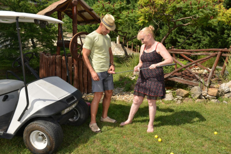 Charming grandma Nanney getting boned by her horny lover on a golf cart