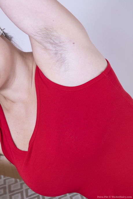 Attractive amateur babe Petra Pitt showcases her monstrous natural boobs and furry crotch