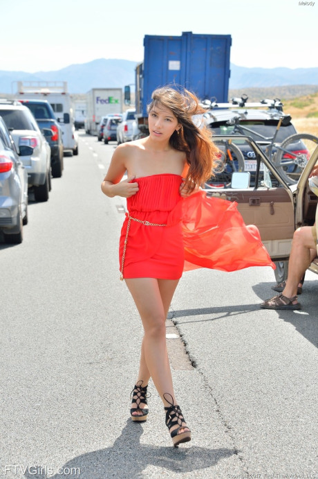 Natural beauty in a long red dress Melody flashing her bald cunt in public
