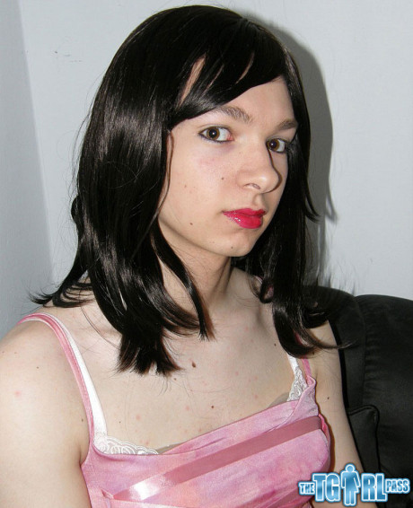 Petite transexual showing off that slender body of hers in a pink dress