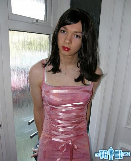 Petite transexual showing off that slender body of hers in a pink dress