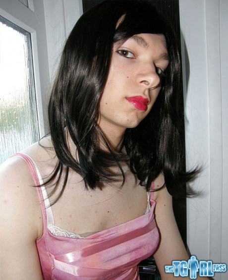 Petite transexual showing off that slender body of hers in a pink dress