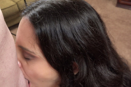 Tattooed MILF Elli X Raven strips totally nude and gives a POV blowjob