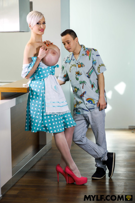 Buxom MILF Tanya Virago takes a cumshot on her giant tits after sleazy sex