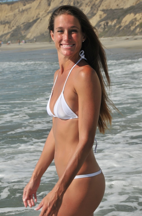Hot MILF Sofie Marie shows her slender body in a charming bikini at the beach