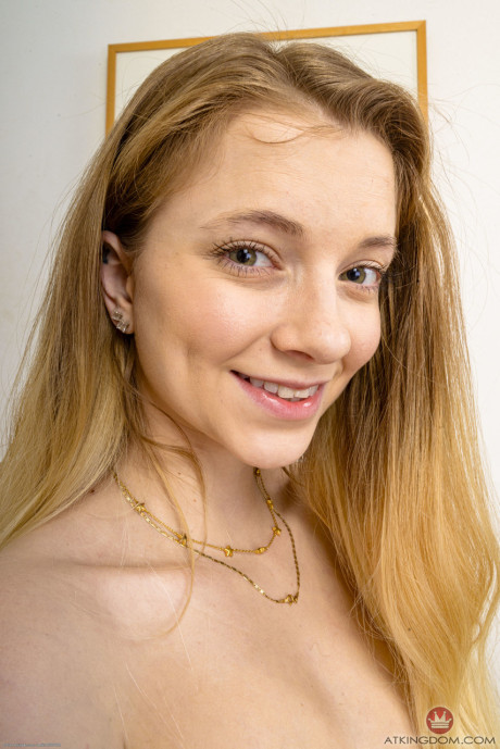 Slim young Riley Star lifts her dress up and spreads her lovely swollen vagina