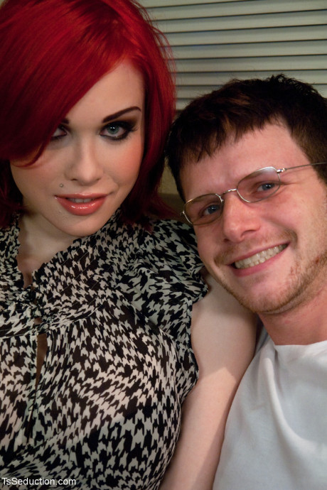 Redheaded transsexual with massive breasts Sarina Valentina receives a bj from her man boyfriend guy