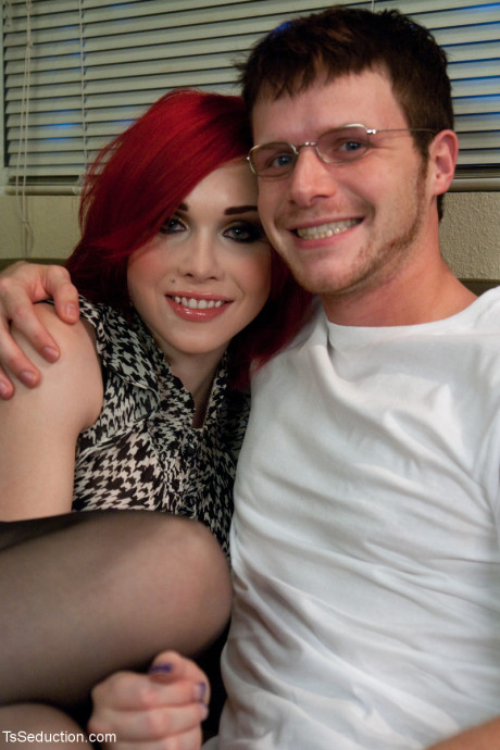Redheaded transsexual with massive breasts Sarina Valentina receives a bj from her man boyfriend guy