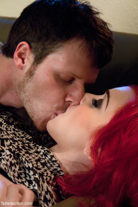 Redheaded transsexual with massive breasts Sarina Valentina receives a bj from her man boyfriend guy