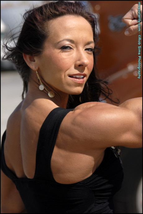 Latina bodybuilder Patricia Beckman flexes in a dress and bikinis as well