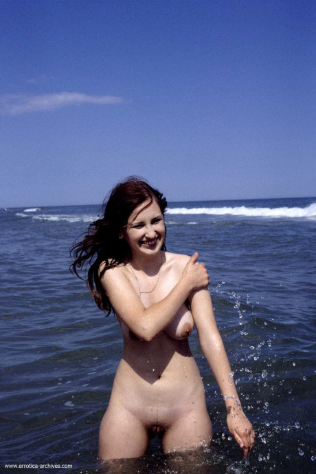 Sensational babe Lenka shows her amazing boobies while taking a bath in the sea