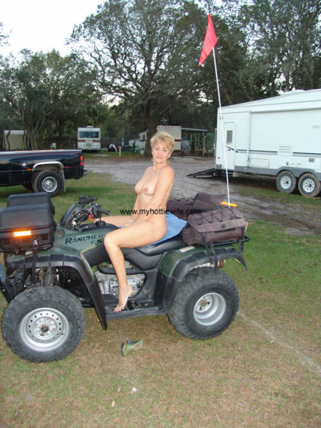 Amateur swinger with fake boobs Tracy suck poses naked on a fourwheeler