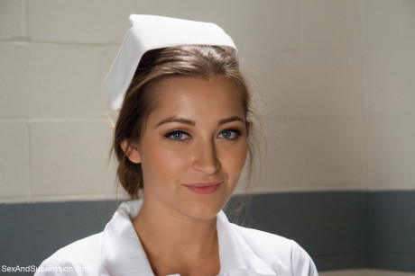 Beautiful nurse with a nice booty Dani Daniels strips and poses in high heels