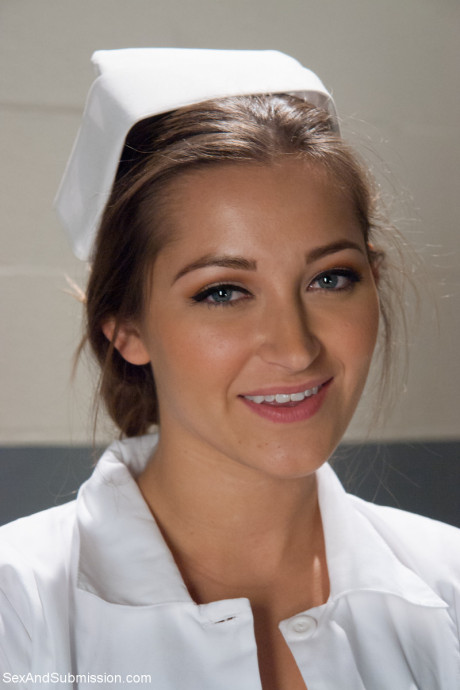 Beautiful nurse with a nice booty Dani Daniels strips and poses in high heels