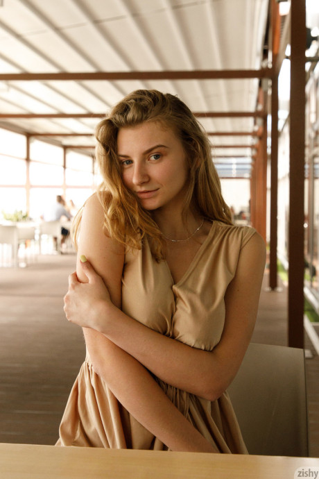Ukrainian babe Regan Budimir flashes her massive tit while posing at the mall