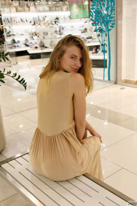 Ukrainian babe Regan Budimir flashes her massive tit while posing at the mall