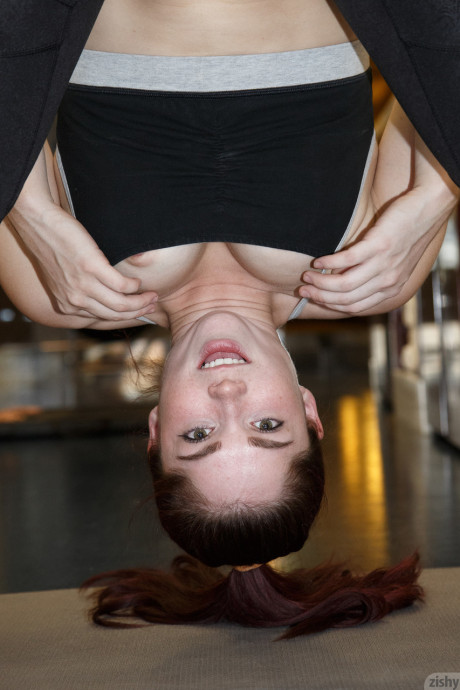 Horny amateur Jazz Reilly stretches and gets nip slip in the gym