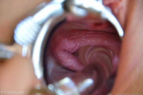 Young teenie babe Roxy fists her clam before playing with a snatch stretcher