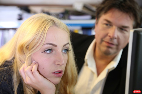 Kinky secretary Liz Rainbow treats her boss to a handjob while dominating him